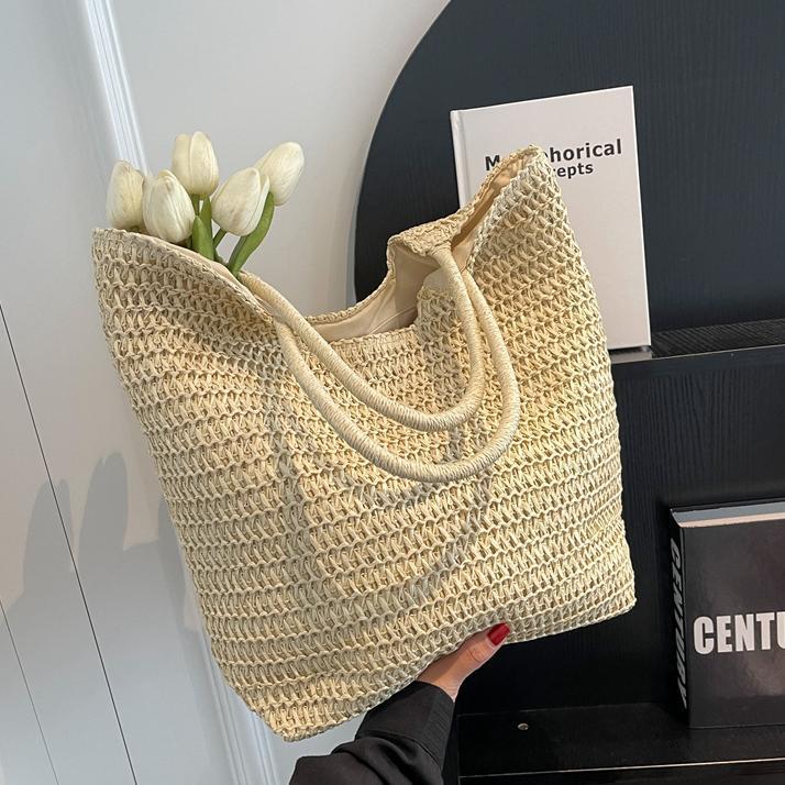 Verano simple y popular bolso de paja femenino 2025 nuevo estilo estilo occidental tejido bolso de playa bolso de viaje de gran capacidad