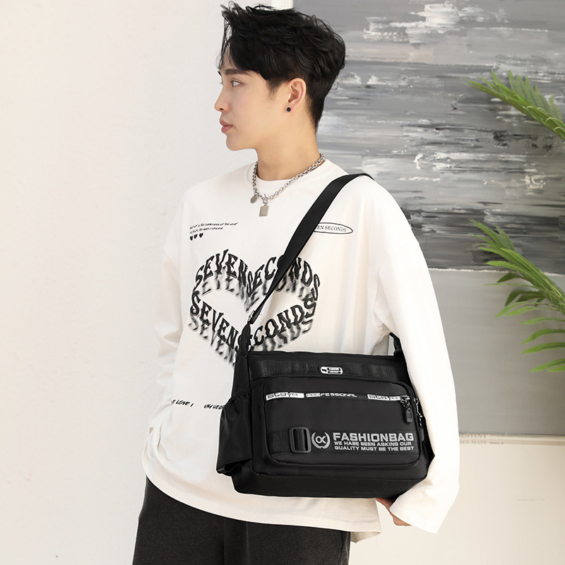 Bolsa de viaje de hombre de gran capacidad, bolso de hombro a prueba de agua, multicapa, bolso de hombro de hombre portátil de corto alcance.