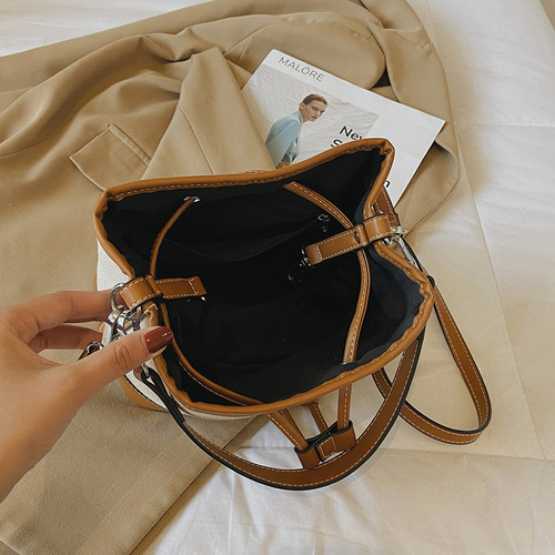 Wholesale women's bags autumn new European and American fashion bags crossbody bag drawstring stitching canvas portable bucket bag