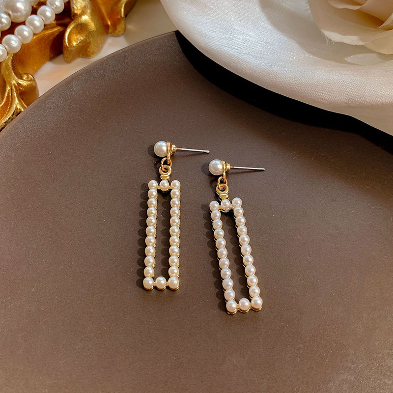 Aguja de plata de moda alta sensación de diamante de goteo de aceite pendientes nicho universal elegante pernos de orejas ligero lujoso temperamento simple orejas para mujeres