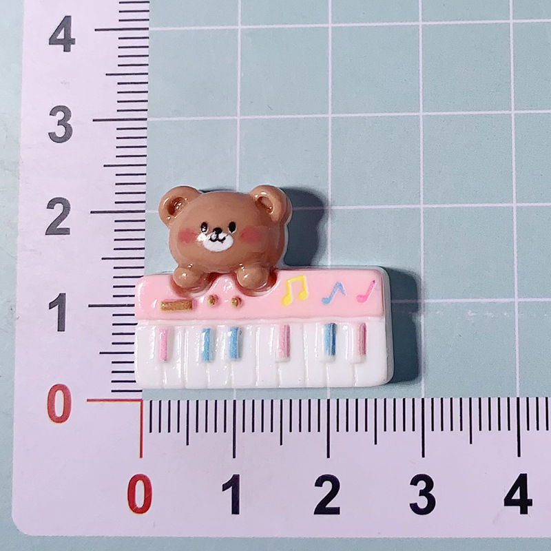 Nuevos dibujos animados brillante cara rosa osos joyería caja de teléfono celular agujero agujero cordón de cabeza de zapato DIY accesorios de resina de pegamento de crema