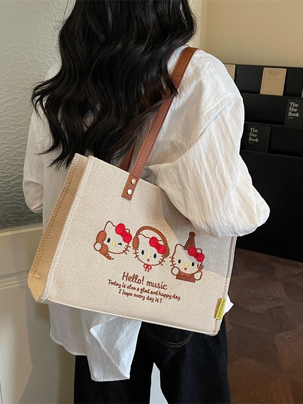 Bolso de lona de gran capacidad para mujeres 2026 nuevo estilo coreano bordado bolso de hombro brazaleta simple bolso de mano