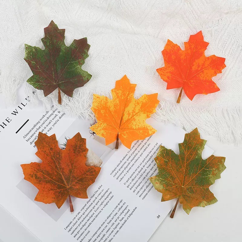 Single simulated maple leaf yellow fake leaves dead leaves fallen…