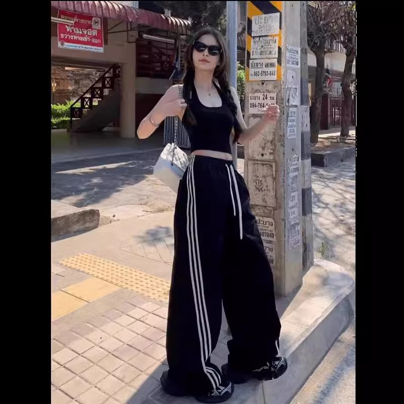 Pantalones deportivos casuales de mujer a rayas negras de la calle alta 2025 nuevo estilo de primavera y otoño sentido del diseño de tres barras pantalones anchos rectos