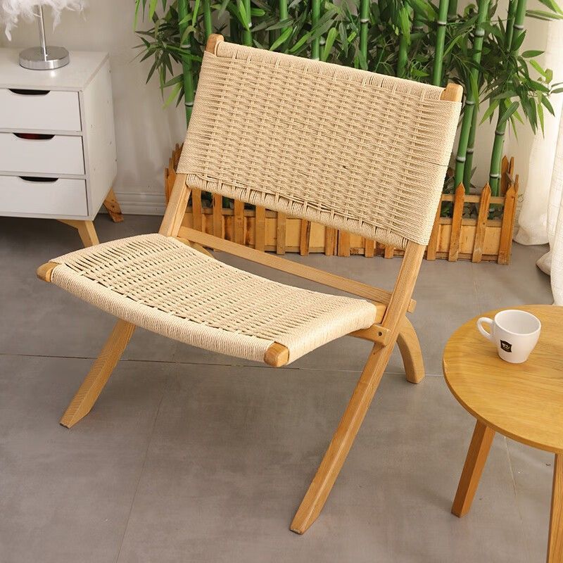 Una silla de silla de madera sólida nórdica sofá retrógrado individual de alojamiento residencial hotel silla de tejido casual