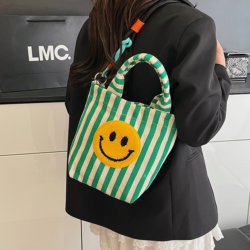 Bolso de moda coreana 2025 nuevo bolso estilo estilo universitario bolso de hombro a rayas lindo sonriente bolso de mensajero mujer