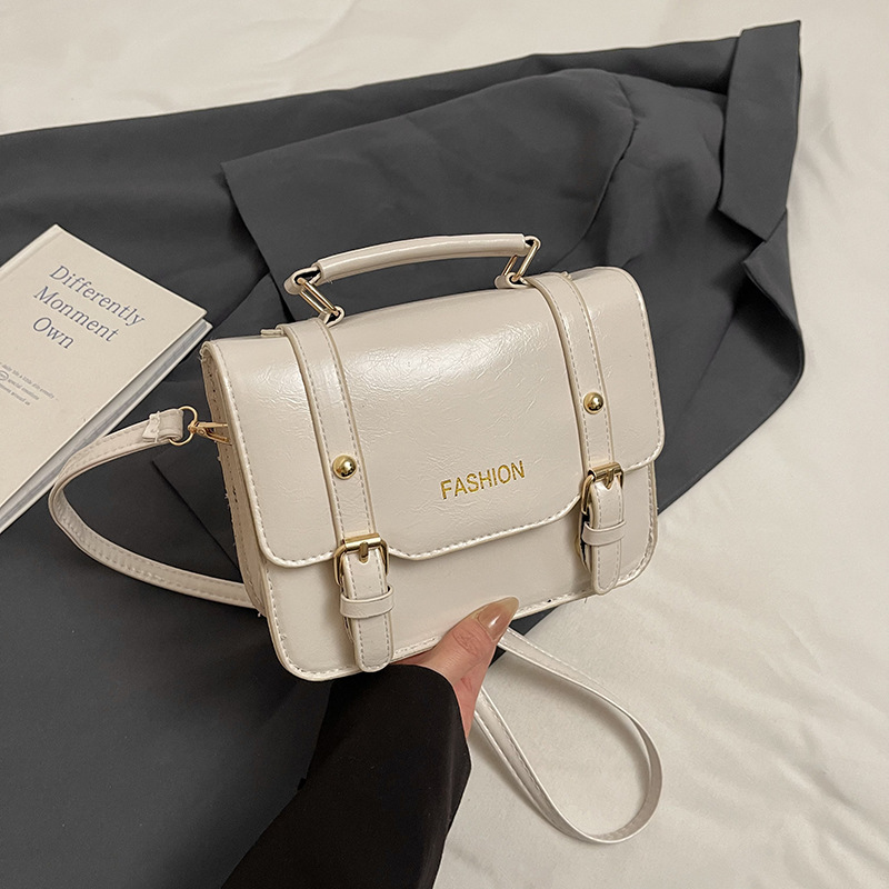 Bolso de mano retro británico para mujeres 2025, nueva moda, bolso cuadrado de color contrastante, bolso de mochila universal, primavera y verano, mujeres extranjeras