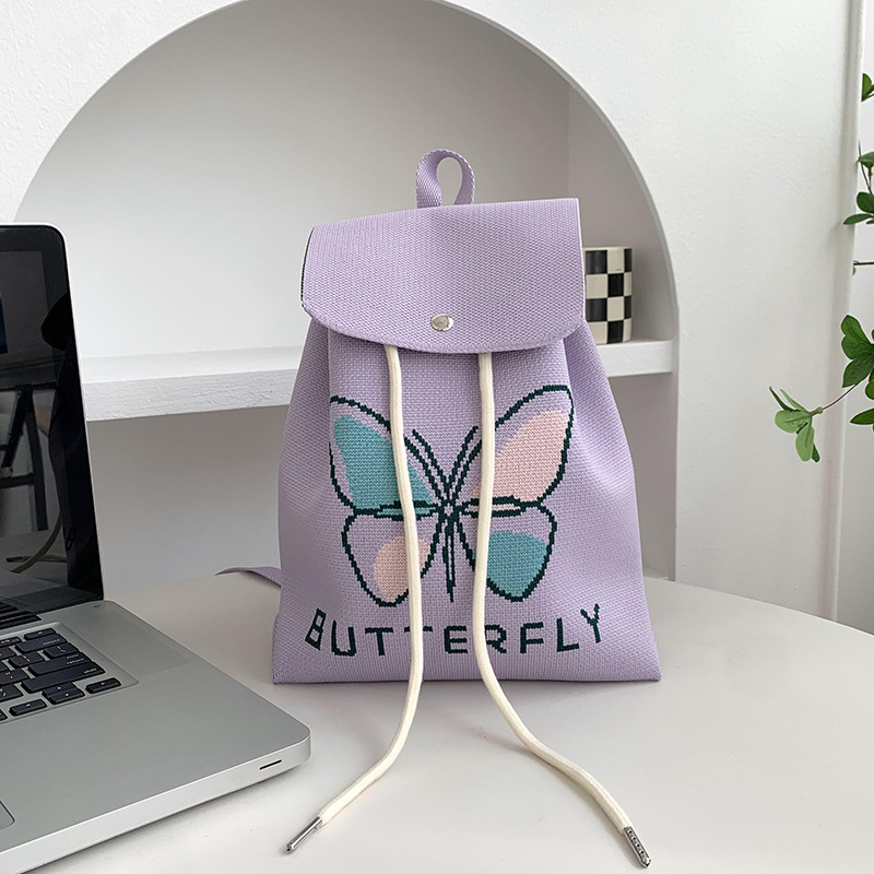 Mochila de alta calidad para damas nueva personalidad de dibujos animados versátil de gran capacidad de viaje bolsa de tejido portátil mochila de punto