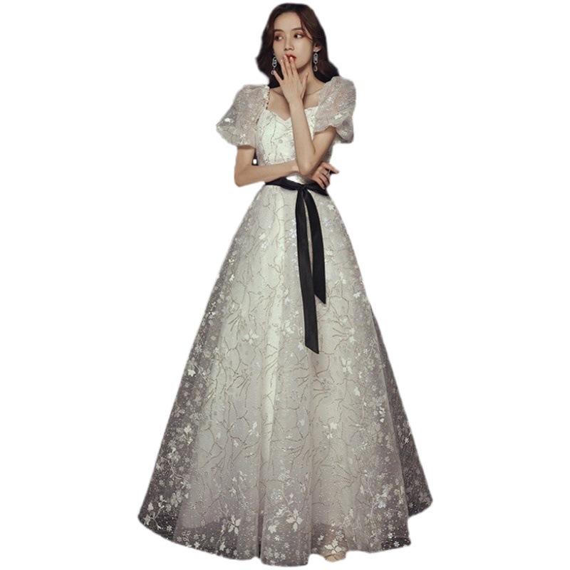 Vestido de noche para banquete, nuevo estilo 2026, blanco, estilo francés, elegante, de hada, largo, con falda abullonada, para fiesta anual.