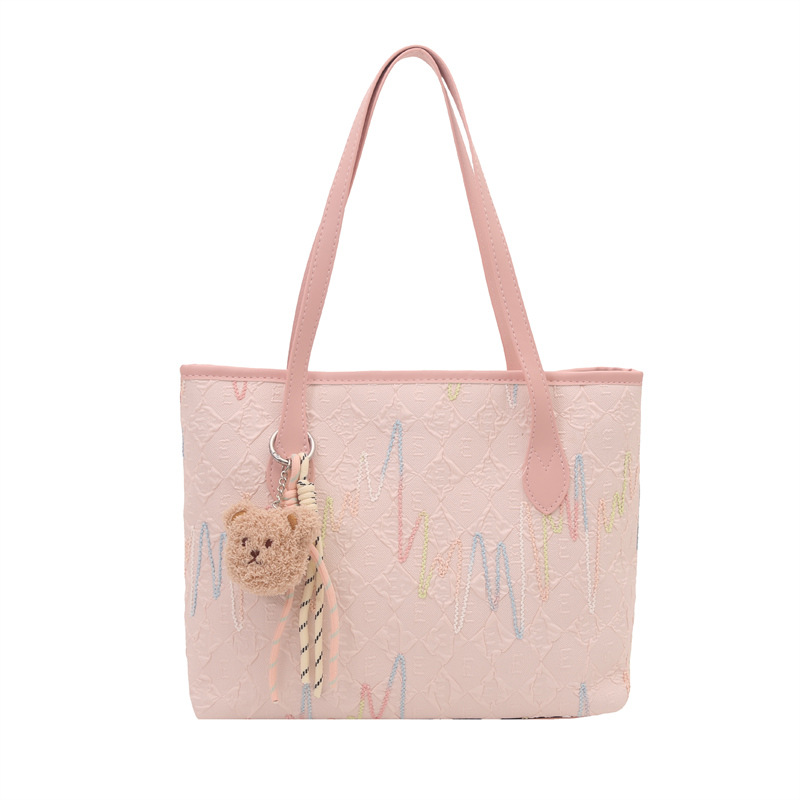 Este año, la popular bolsa de mujer de gran capacidad 2025, un nuevo colgante simplista y lindo, textura de la mochila de viaje al trabajo.