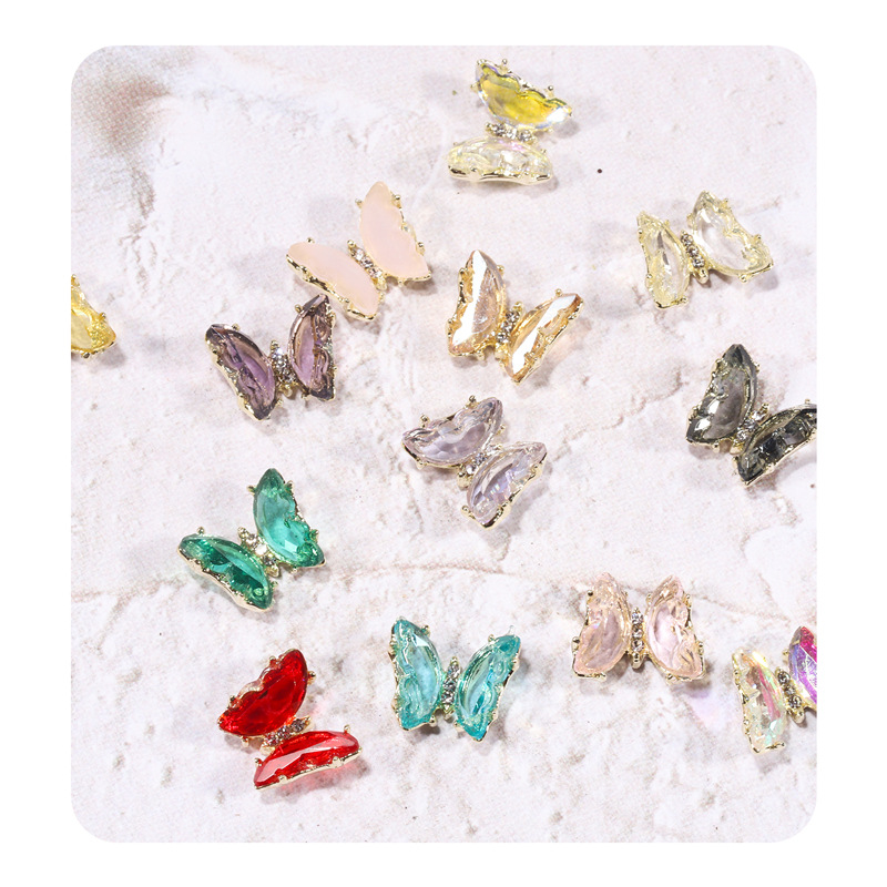 2021 nueva celebridad en línea belleza de uñas mariposa de cristal mágico estilo INS hielo tridimensional transparente Aurora diamante metal decoración de uñas