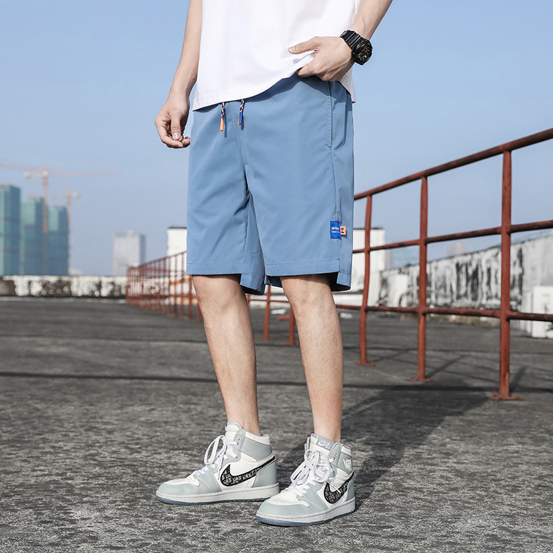 Pantalones de verano para hombres, pantalones cortos casuales de moda para hombres, pantalones de playa sueltos, fábrica directa.