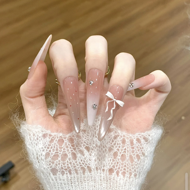 Vibrant and Beautiful Girl with Long Pointed Nails, Translucent Gradient Cat-Eye Polka Dot Three-Dimensional Bow, and Brightening Wearable Nail Tips