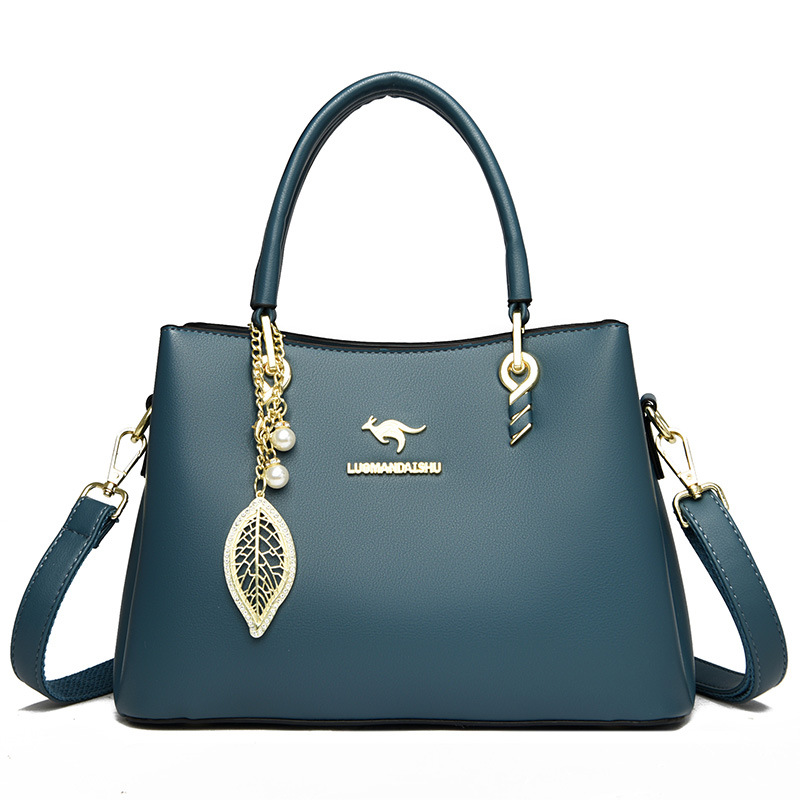 2023 nuevo práctico de gran capacidad simple viajero bolsa de mensajero de las mujeres bolsa de tres capas boca brillante cuero suave entrega de una pieza