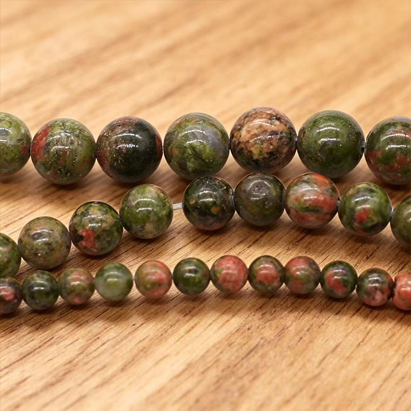 Los fabricantes suministran directamente collares de pulsera de cuentas dispersas de cuentas redondas de esmeralda natural DIY joyas semiacabadas al por mayor