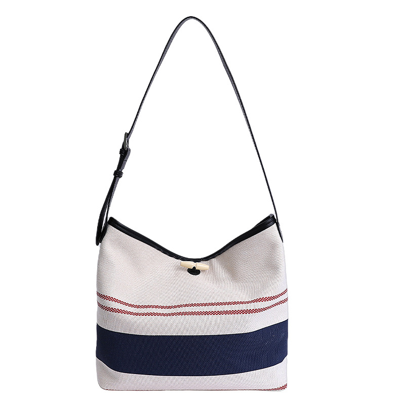 Bolso mujer 2025 nuevo bolso de cubo a rayas simple moda bolso de hombro casual de alta gama bolso de mensajero casual