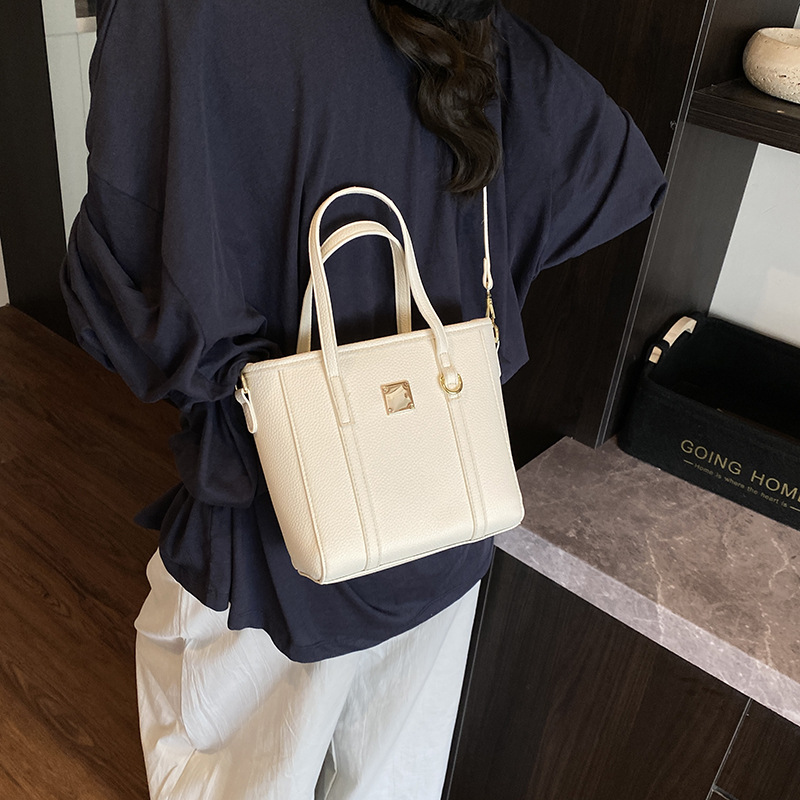 Tendencias de moda de comercio exterior bolso de cubo de mano femenino 2025 nuevo estilo estilo occidental bolso de hombro todo fósforo bolso de mensajero de viaje de trabajo