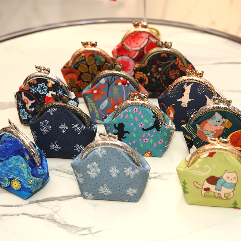 Bolsa de material de bordado bricolaje hecho a mano 8,5 boca Bolsa de Oro patchwork bolsa antigua bolsa transfronteriza inglés gato bolsa de almacenamiento