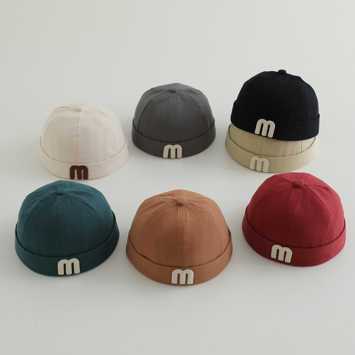 letras coreanas m niños terratenientes sombrero primavera y otoño modelado cóncavo de moda para hombres y mujeres bebés sombrero de tela de color sólido