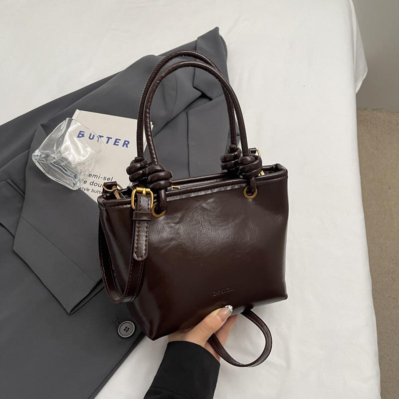 Alta sensación retro bolso para mujeres 2024 nuevo estilo versátil tendencia bolso de hombro bolso explosivo bolso de cubo portátil