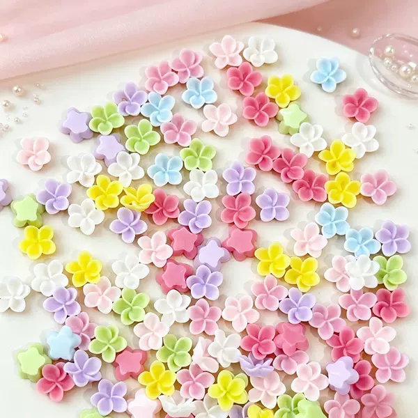 Wholesale nail art decorations: miniature, three-dimensional, five-petal flowers in macaron colors, including small daisies and morning glories, made of resin for DIY projects