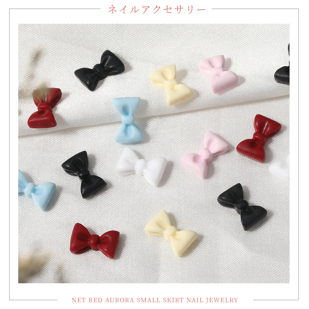 White accessory for manicure with bow