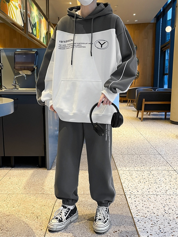 Otoño y invierno de hombre suelto encapuchado juego deportivo casual juvenil hombre con camiseta gruesa de dos piezas