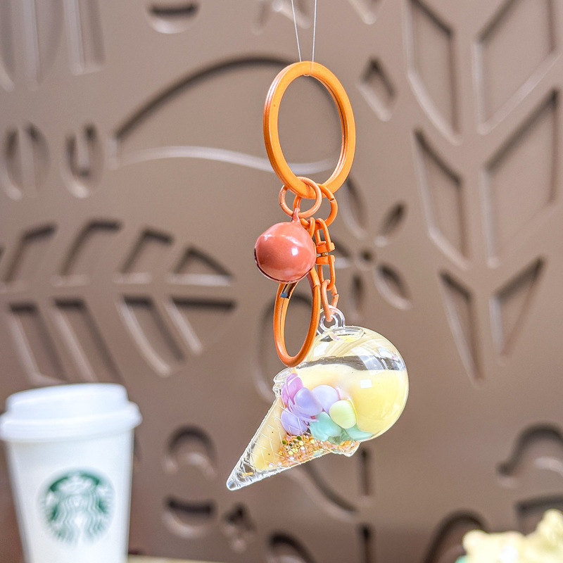 Caricatura en aceite líquido arena flotante botella mochila llavero delicado colgante accesorios accesorios máquina de muñecas pequeños regalos al por mayor