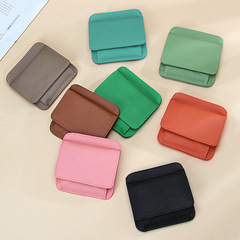 Leather coin purse with a minimalist and compact design, suitable for travel. It's a thin and lightweight card case made of top-grade leather, featuring a modern, Japanese-style design and is ideal for international trade.