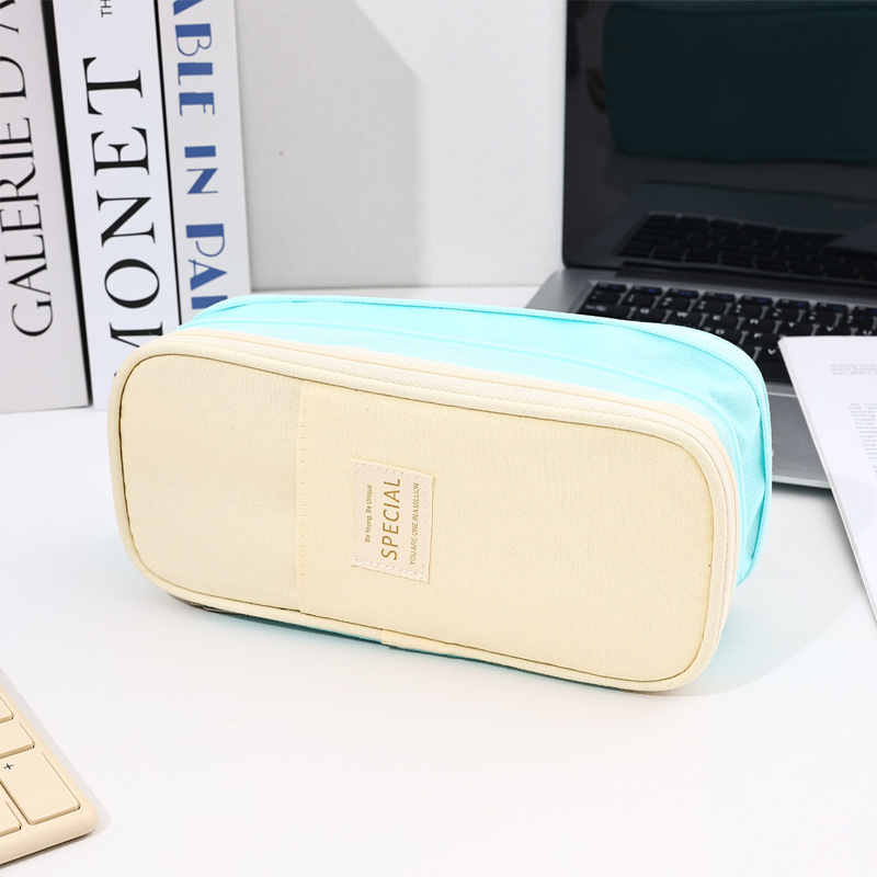 Bolso de lápices retráctil de lona de color de contraste de estilo explosivo transfronterizo Bolso de papelería de gran capacidad con doble cremallera simple multifuncional para estudiantes