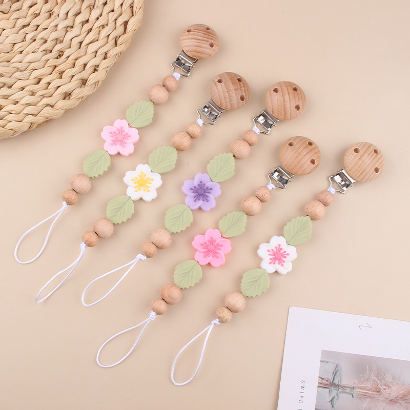 Nuevo clip de chupete de haya para bebés, dibujos animados creativos para bebés, flor de begonia, muerde los dientes, cadena de chupete anti-caída