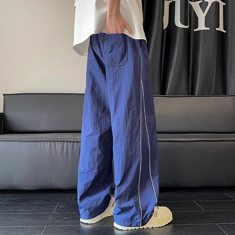Pantalones blancos de línea clara para hombres de verano delgados pantalones deportivos de pierna ancha de marca de moda pantalones casuales de hombre rectos sueltos