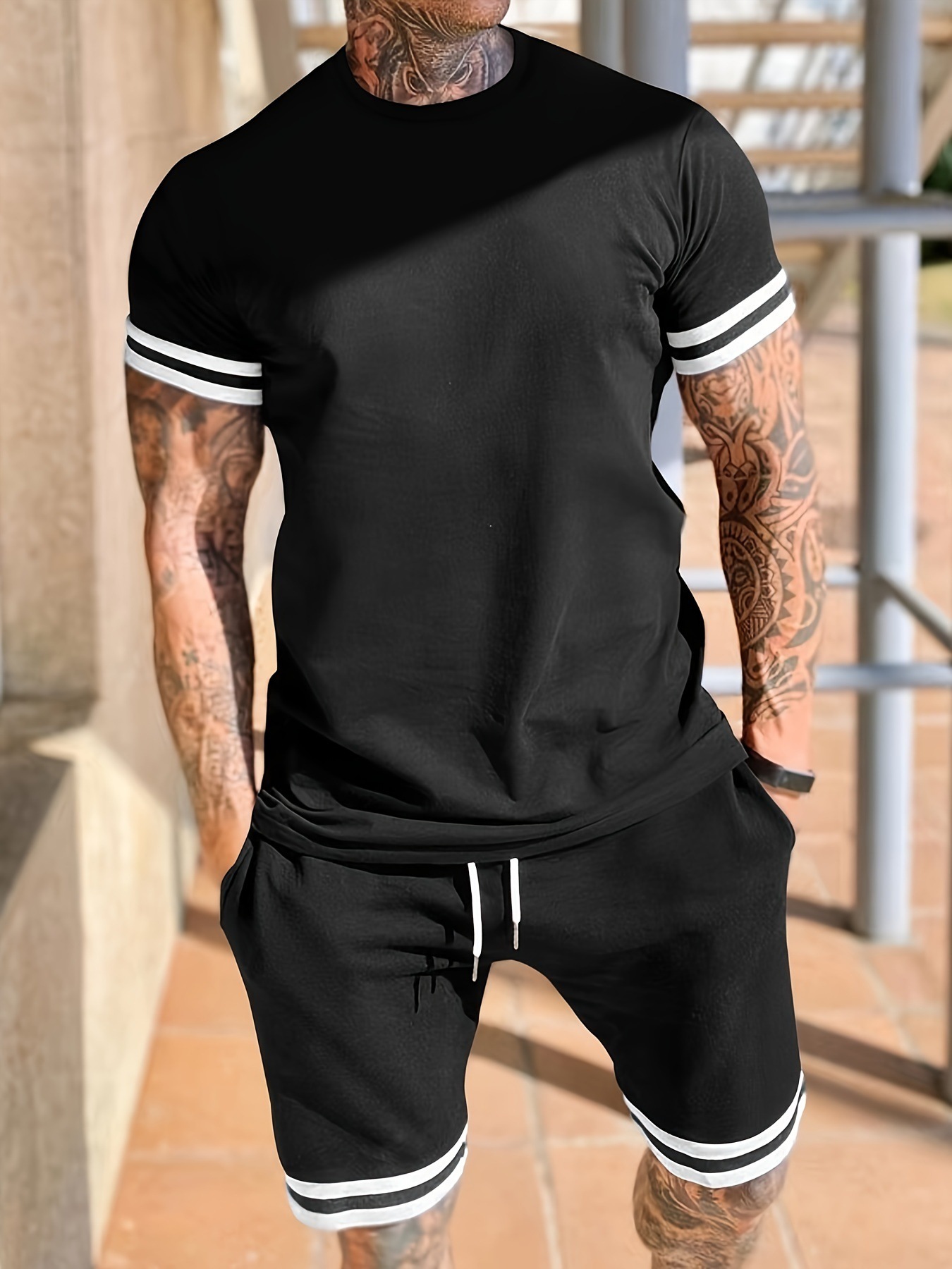 Europa y los Estados Unidos transfronterizos nuevos hombres de verano de manga corta camiseta de cuello redondo juego deportivo de pantalones cortos casuales de dos piezas para hombres
