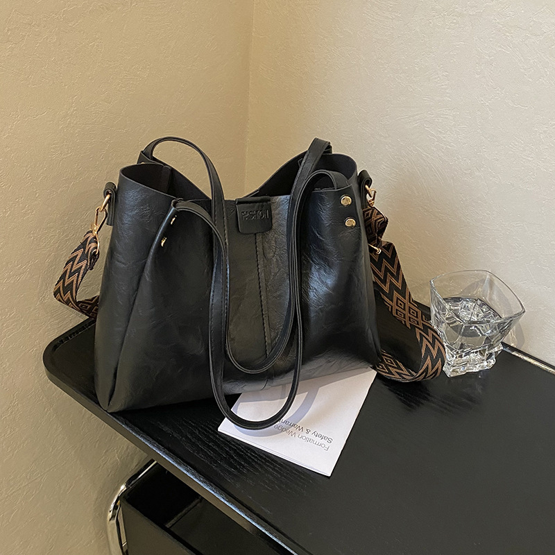 Europa y los Estados Unidos retro gran capacidad de transporte tote2025 nuevo bolso textura ancha cintura de hombro mochila bolso de hombro