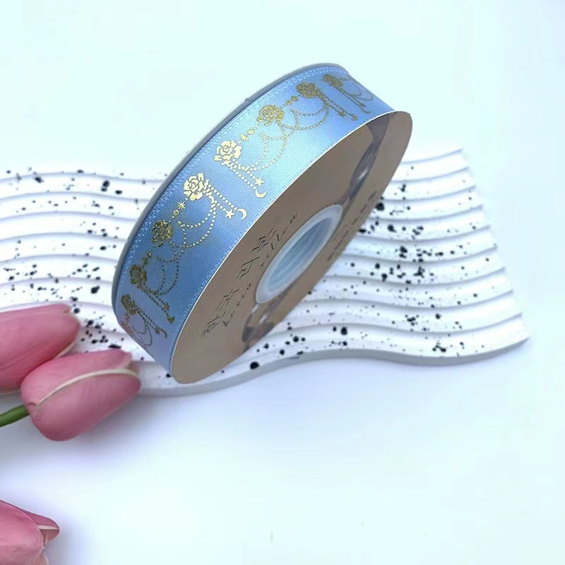 2,5 cm láser cinta de oro estrella Luna flor joyería DIY caja de regalo embalaje barra soporte cinta hecha a mano nueva venta al por mayor