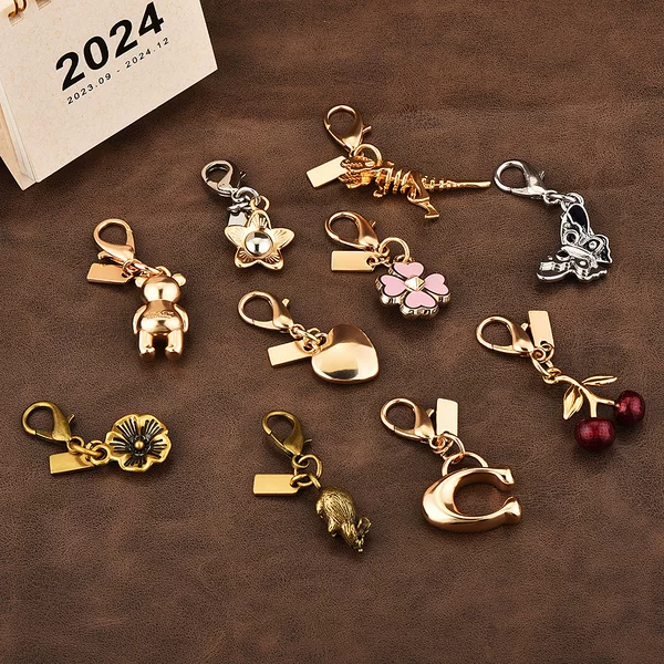 Car key pendant high sense bag accessories gold color bear cherry four-leaf clover butterfly schoolbag jewelry wholesale