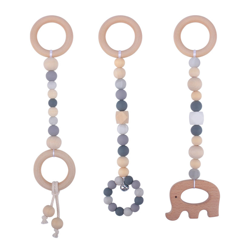Nuevo Bebé calmante juguetes traje bebé cuentas de silicona haya molares mordedor juguetes pequeña campana Amazon