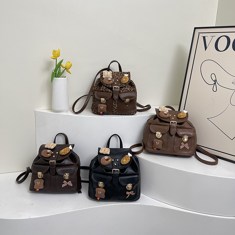 Moda leopardo mochila para niños y niñas lindo muñeca de peluche colgante mochila para niños otoño y invierno nueva mochila para niños