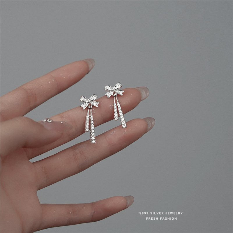 Orecchini a lobo a forma di fiocco in argento puro 999_voghion.com