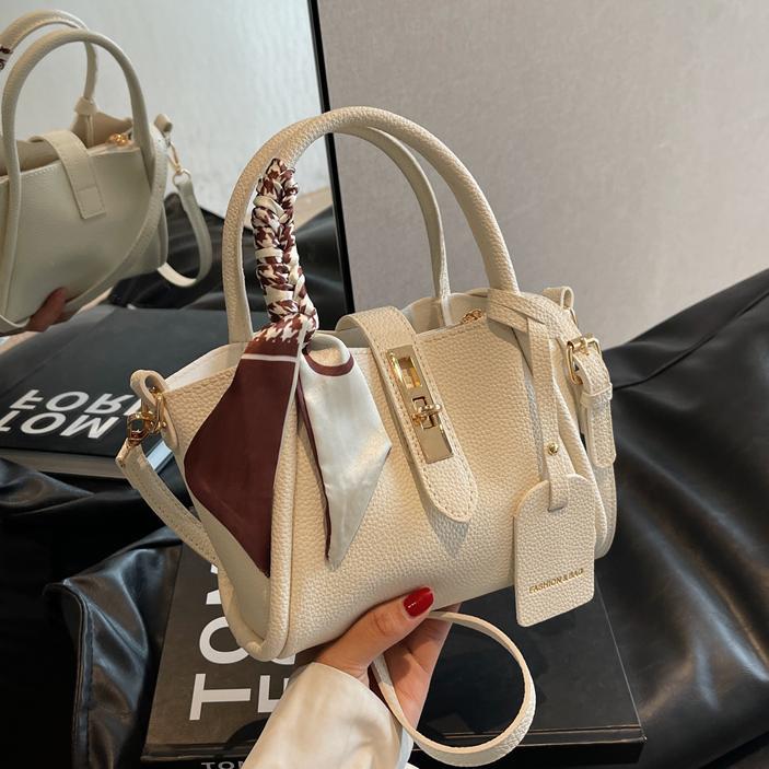 Bolso de mano de estilo occidental de alta gama para mujer 2024 nuevo bolso de cubo de agua de fuego súper popular bolso de mensajero retro de tendencia salvaje