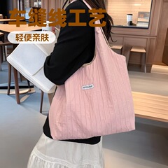 韓国系シンプルで怠惰なバッグ女性2025新型insカジュアルハンドバッグ大容量筋理感トートバッグ