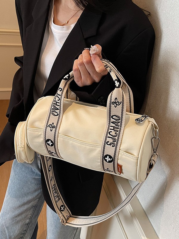 Oxford tela de contraste de color ligero bolso cilíndrico de mano casual para mujeres 2025 nuevo alto valor ocio transporte de viaje mochila