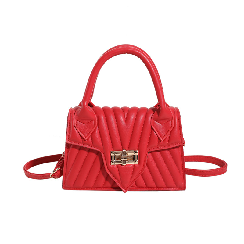 Textura 2025 nueva moda de impresión de estilo extranjero rotary-lock mochila de hombro casual color caramelo bolso de mano de mujer