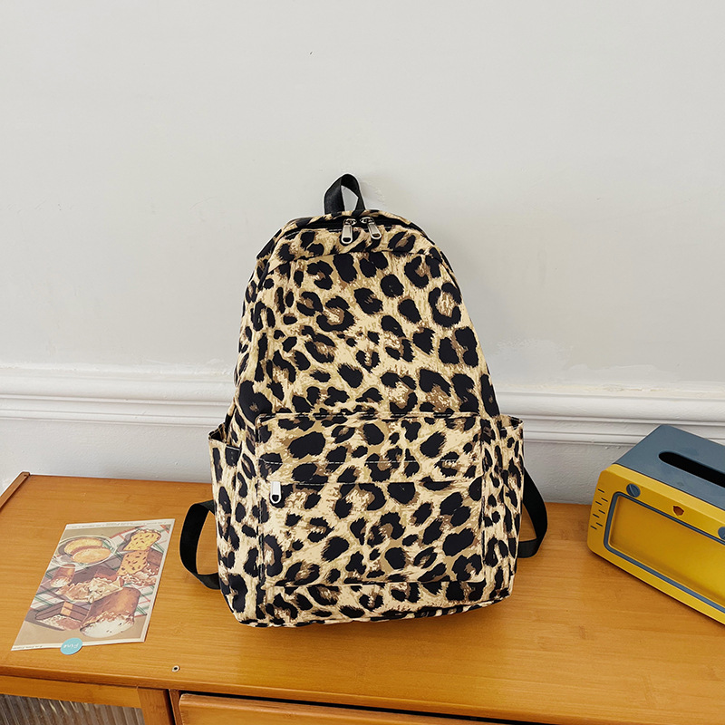 日系软妹可爱搞怪奶牛斑点双肩包软萌甜美少女学院风帆布学生书包