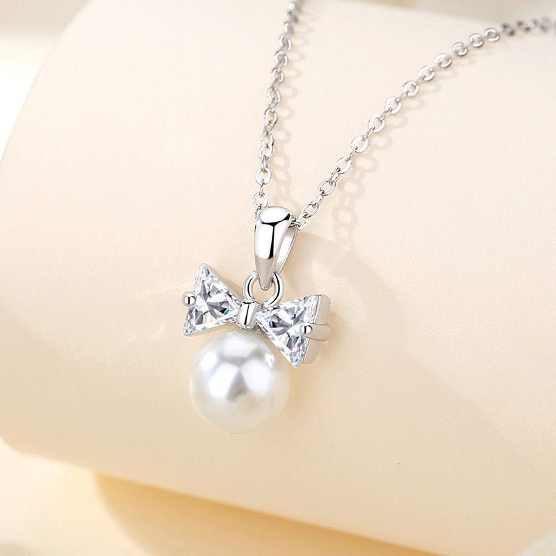 S925 collar de perlas de plata esterlina lazo collar de estilo de lujo ligero collar largo de alta gama lujo ligero nicho