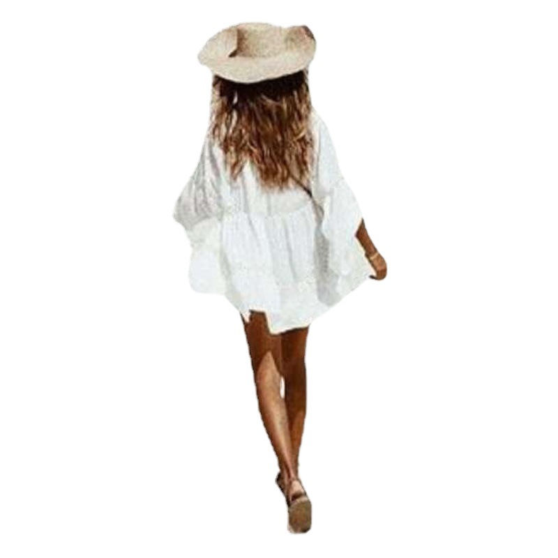 Venta caliente nueva camisa hueca europea y americana campana manga playa blusa camisa de protección solar traje de baño abrigo mujer blusa