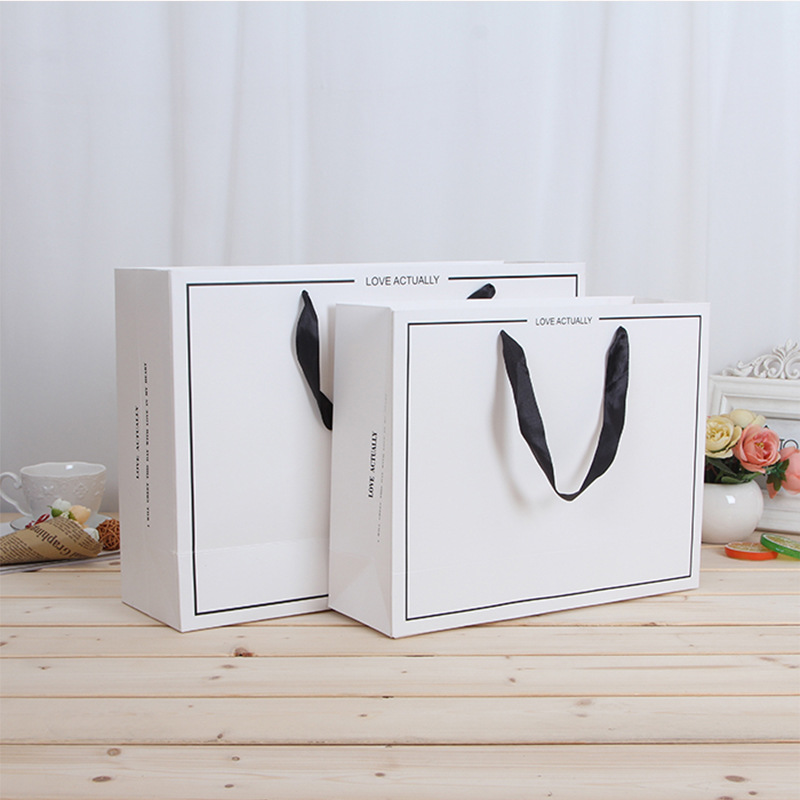 白卡服装手提纸袋购物包装袋袋子高级感礼品袋手拎纸袋定制小批量