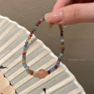 Single pink bead rainbow bracelet