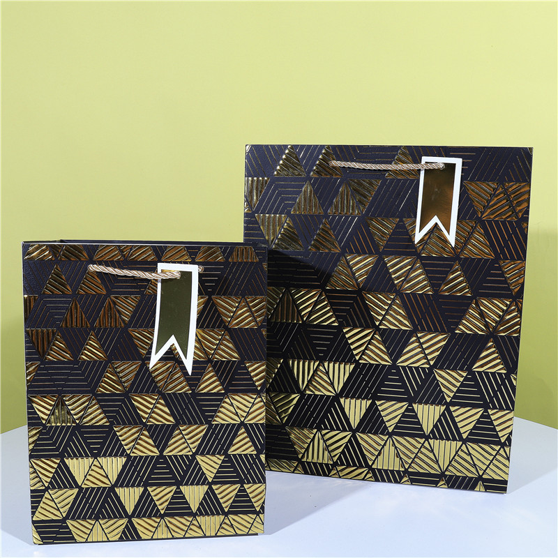 Kazakhstan Style Handbag Paper Bag with Double Embossing and Gold Stamping Packaging Gift Paper Bag Wholesale in Stock Kazakhstan Style Handbag Paper Bag with Double Embossing and Gold Stamping Packaging Gift Paper Bag Wholesale in Stock