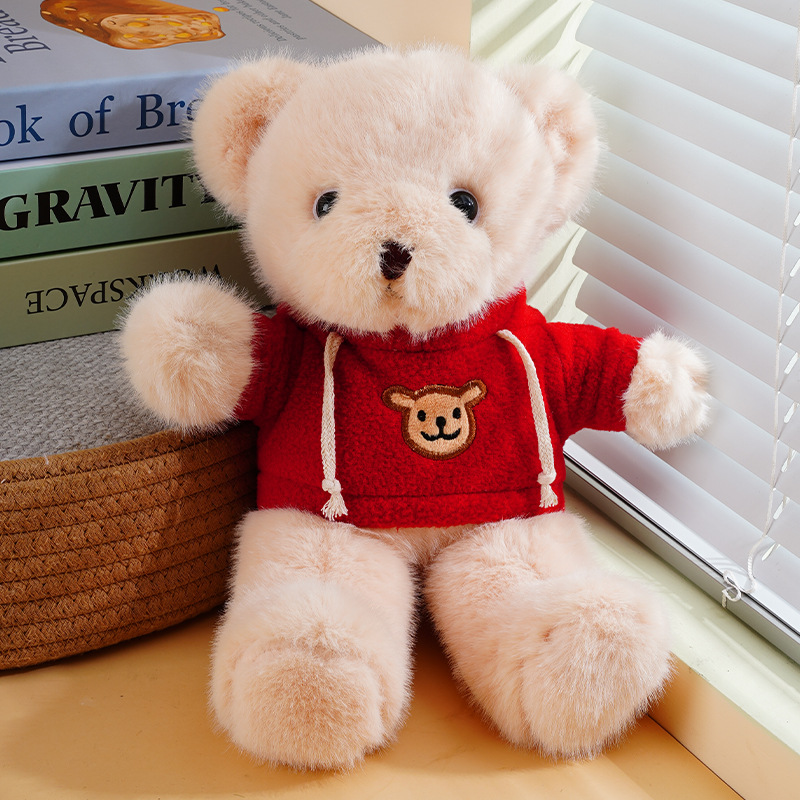 Suéter rojo de oso marrón claro